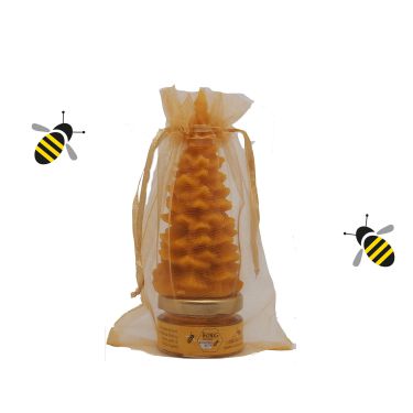 Ein Gläschen Bio Honig und eine Bienenwachskerze in Christbaumform bereiten Freude und sind ein ideales Weihnachtsgeschenk.